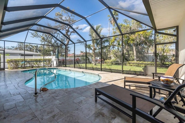 view of pool featuring a patio and glass enclosure