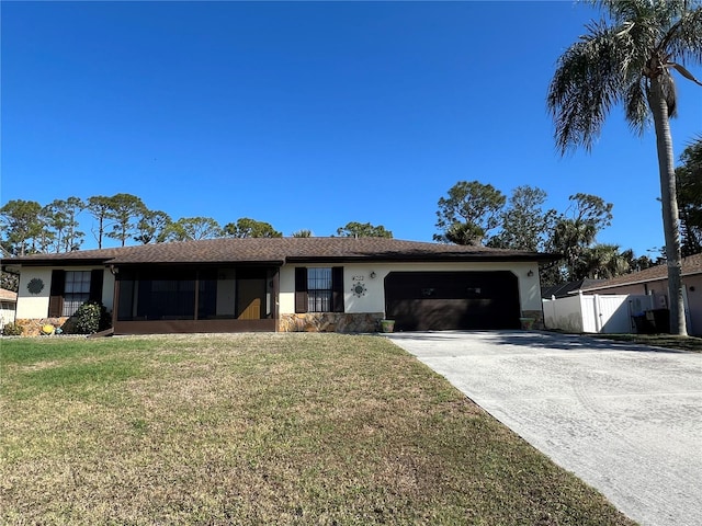 ranch-style home with a garage and a front yard