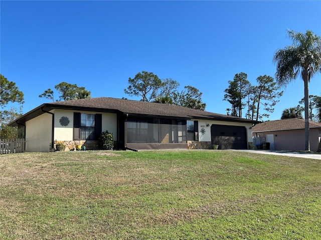 ranch-style home with a garage and a front yard