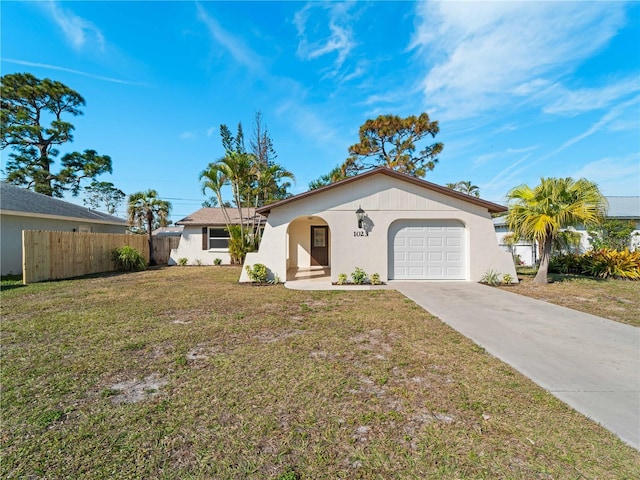 single story home with a garage and a front yard