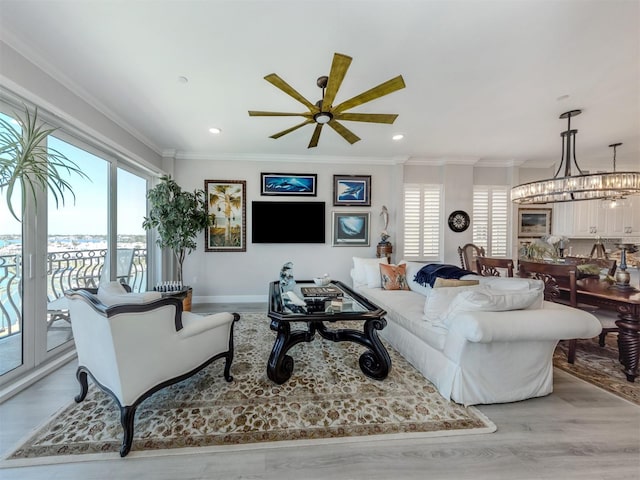 501 Tamiami Trl N Unit 502, Venice, FL 34285 - living area with light wood finished floors, plenty of natural light, crown molding, and recessed lighting