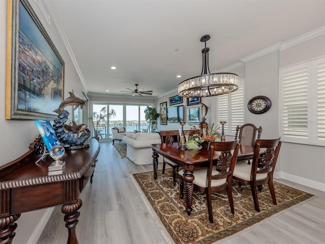 501 Tamiami Trl N Unit 502, Venice, FL 34285 - dining area with ceiling fan, recessed lighting, wood finished floors, baseboards, and crown molding