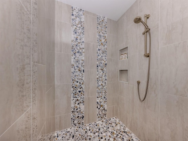 501 Tamiami Trl N Unit 502, Venice, FL 34285 - bathroom featuring tiled shower