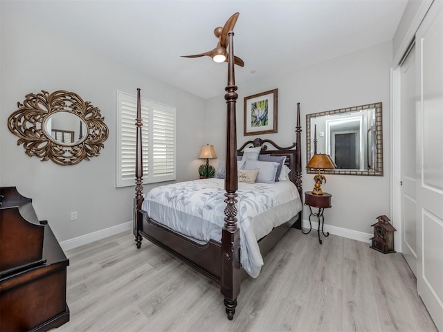 501 Tamiami Trl N Unit 502, Venice, FL 34285 - bedroom with light wood-style flooring, baseboards, and ceiling fan