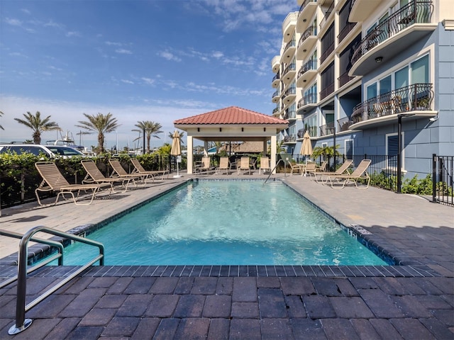 501 Tamiami Trl N Unit 502, Venice, FL 34285 - community pool with a patio area, fence, and a gazebo