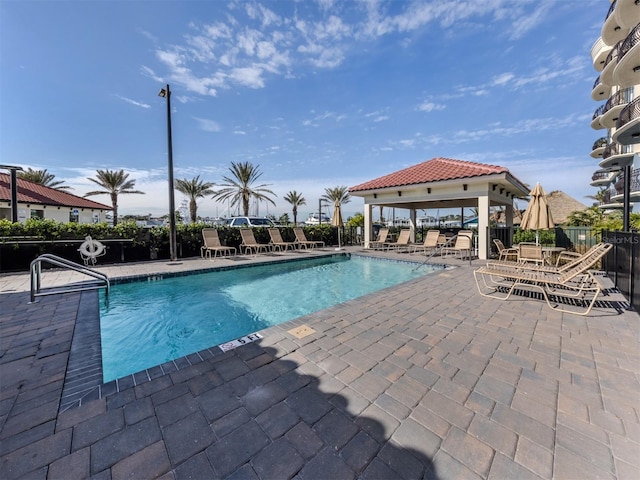 501 Tamiami Trl N Unit 502, Venice, FL 34285 - community pool with a patio area, fence, and a gazebo