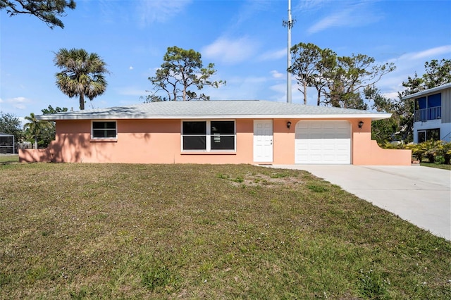 single story home with a garage and a front lawn