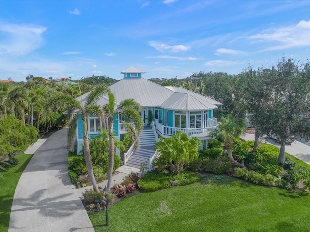 beach home with a front yard