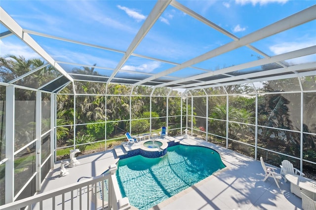 view of pool featuring an in ground hot tub, a lanai, and a patio area