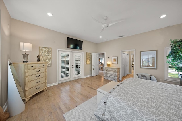 bedroom featuring ceiling fan, light hardwood / wood-style floors, french doors, and access to exterior