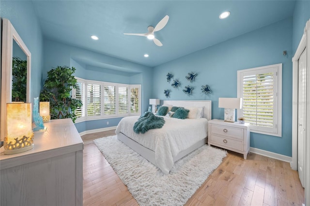 bedroom featuring light wood-type flooring and ceiling fan