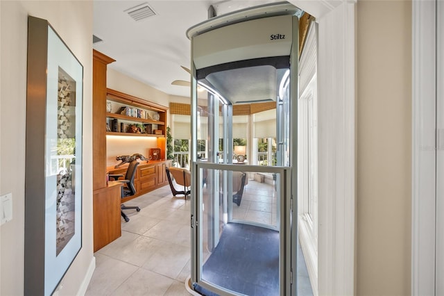 interior space featuring french doors and light tile patterned floors