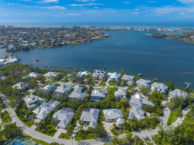 birds eye view of property with a water view