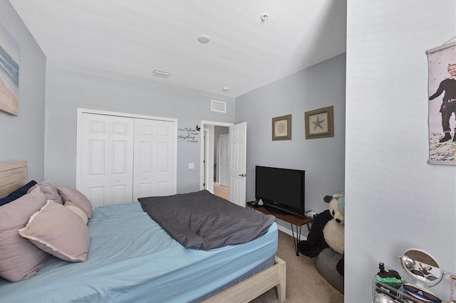 carpeted bedroom featuring a closet