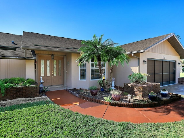 ranch-style house featuring a garage