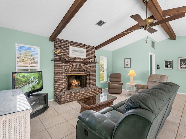 tiled living room featuring a brick fireplace, a textured ceiling, vaulted ceiling with beams, and ceiling fan