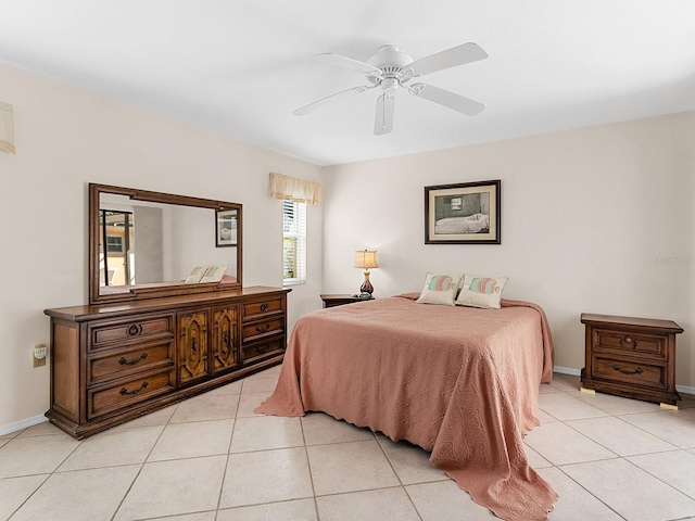 tiled bedroom with ceiling fan