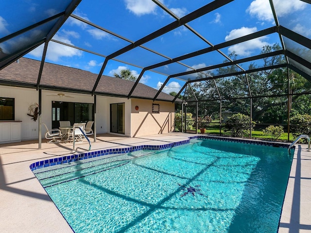 view of pool featuring a patio, a lanai, and ceiling fan