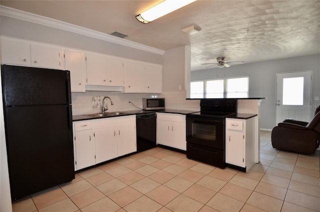 kitchen with white cabinetry, sink, backsplash, and black appliances