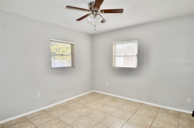 unfurnished room featuring ceiling fan and light tile patterned floors