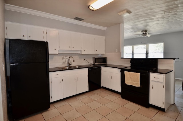 kitchen featuring light tile patterned flooring, tasteful backsplash, sink, white cabinets, and black appliances