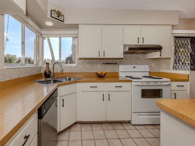 kitchen featuring sink, white cabinetry, light tile patterned floors, electric range, and dishwasher