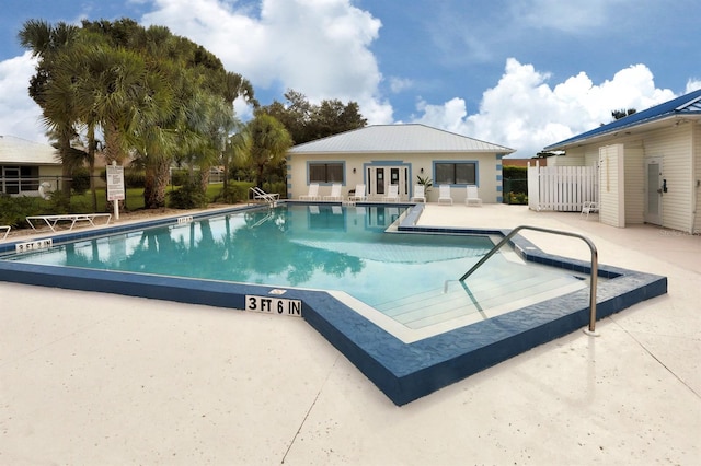 view of swimming pool featuring a patio area