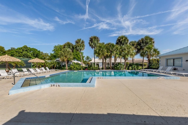 view of swimming pool featuring a patio area