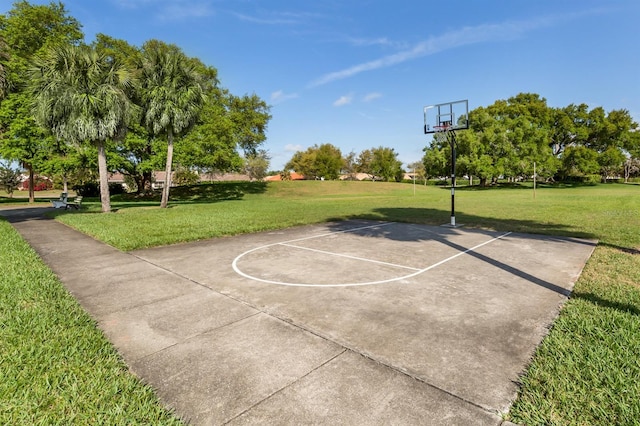 view of basketball court featuring a lawn