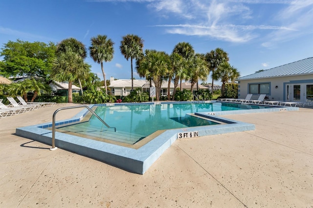 view of swimming pool featuring a patio