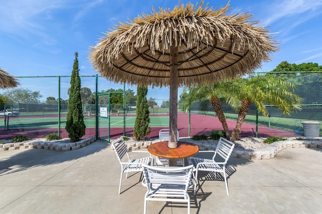 view of patio / terrace featuring tennis court