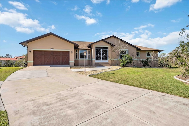 single story home featuring a garage and a front yard