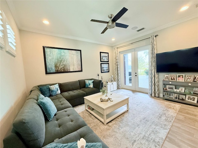 living room featuring french doors, ceiling fan, wood-type flooring, and crown molding