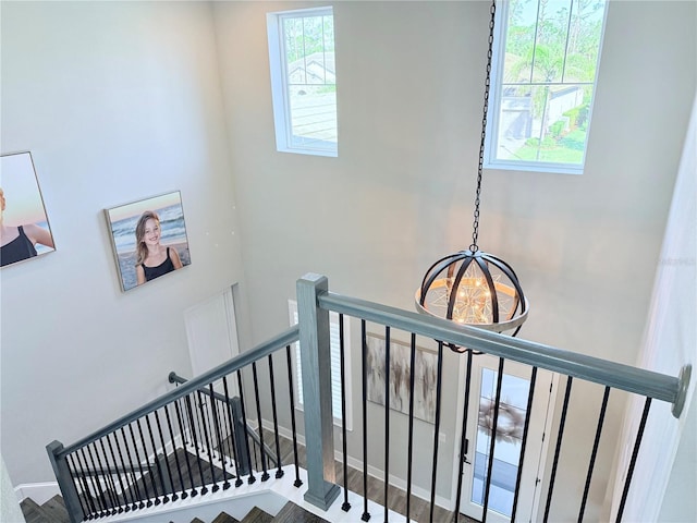 stairway featuring a high ceiling