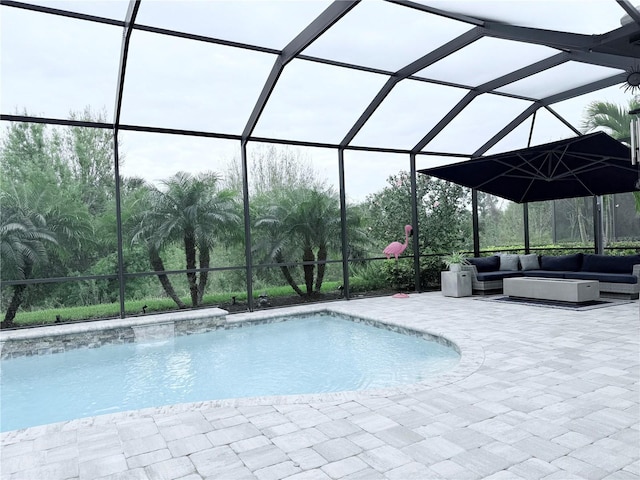 pool with a patio area, an outdoor living space, and a lanai