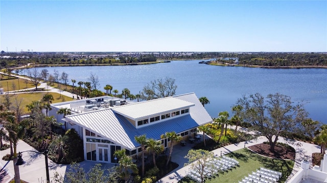 birds eye view of property with a water view