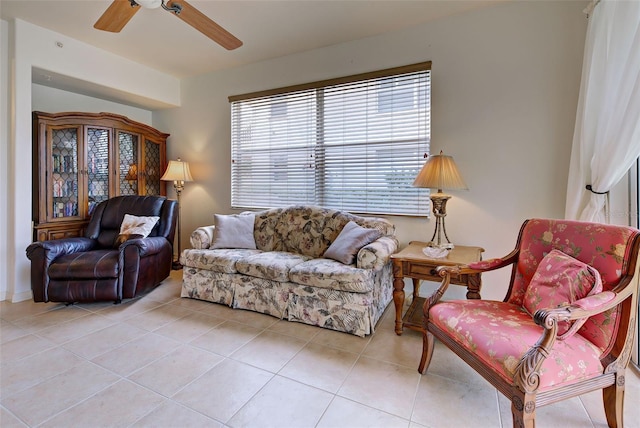 living room featuring light tile patterned floors and ceiling fan