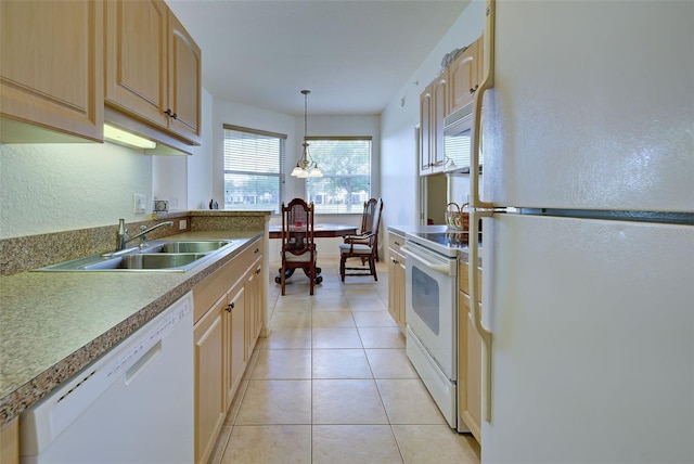 kitchen featuring pendant lighting, light brown cabinetry, sink, light tile patterned floors, and white appliances