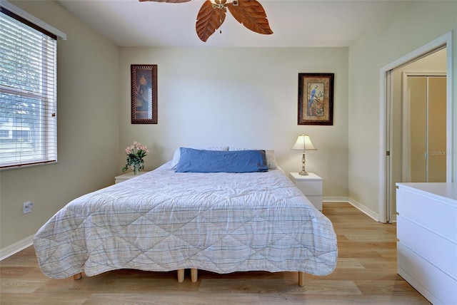 bedroom with ceiling fan and light hardwood / wood-style flooring