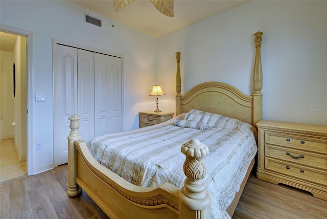 bedroom with a closet and light wood-type flooring