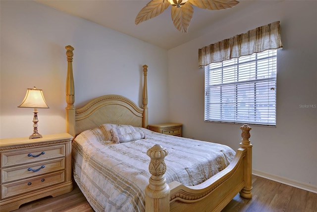 bedroom with light hardwood / wood-style flooring and ceiling fan