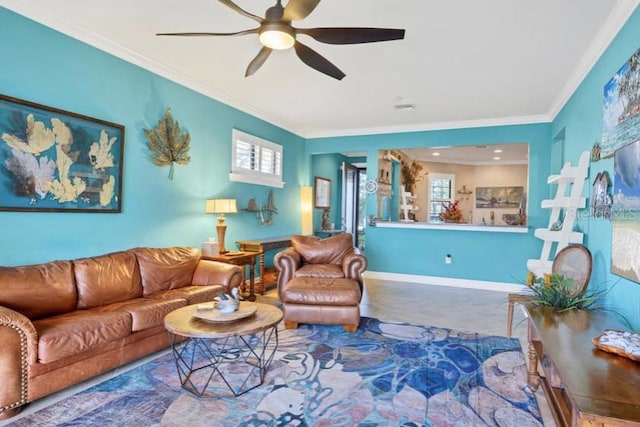 living room featuring carpet floors, ornamental molding, and ceiling fan