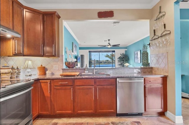 kitchen featuring sink, decorative backsplash, ornamental molding, and stainless steel appliances