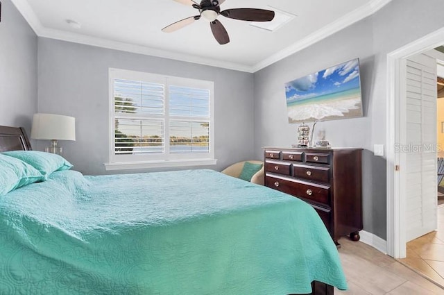 tiled bedroom featuring ornamental molding and ceiling fan