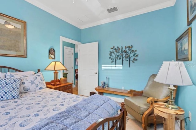 bedroom with ceiling fan and ornamental molding