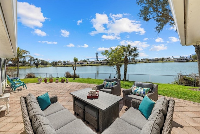 view of patio with a water view and an outdoor hangout area