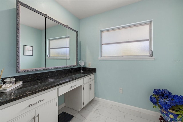 bathroom featuring vanity and a healthy amount of sunlight