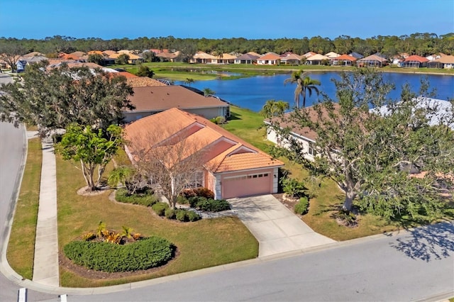 birds eye view of property featuring a water view