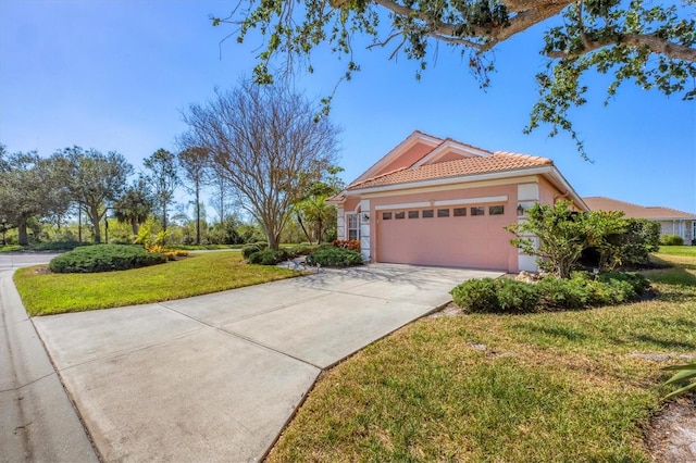 view of front of house with a garage and a front yard