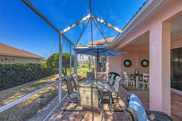 view of patio with a lanai